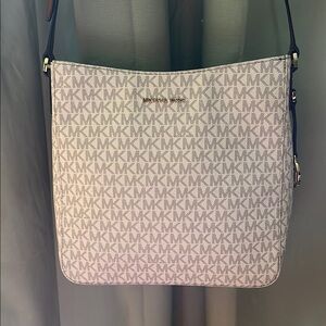 Brand new Michael Kors Crossbody purse. Jet set travel colors vanilla.